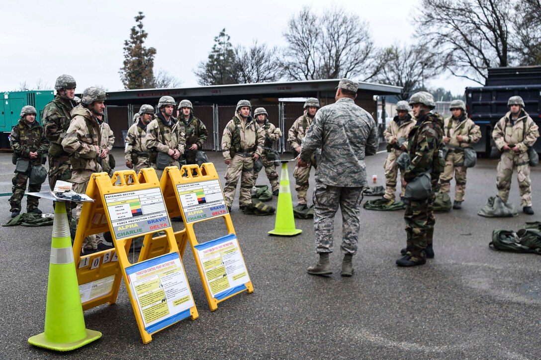 Airmen assigned to the 144th Fighter Wing get dressed in mission oriented protective posture gear as part of the chemical, biological, radiological, and nuclear training portion of the expeditionary skills course held at the Fresno Air National Guard Base March 5, 2016.  The ESC included training in both CBRN and self-aid and buddy care. (U.S. Air National Guard photo by Senior Airman Klynne Pearl Serrano)