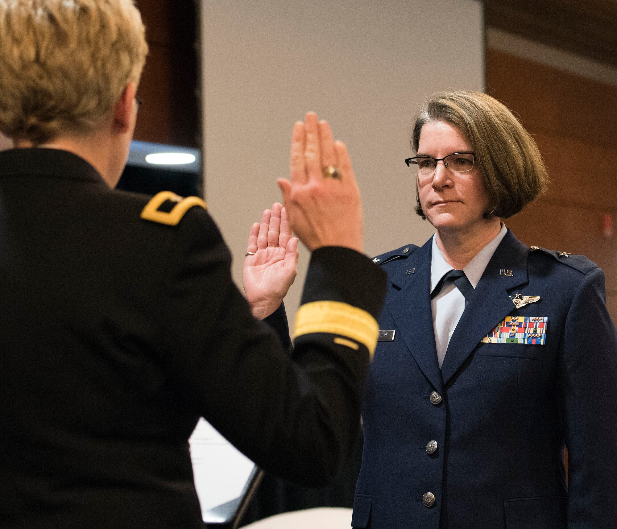 JOINT BASE ELMENDORF-RICHARDSON, Alaska -- Brig. Gen. Laurie Hummel (left), adjutant general of the state of Alaska, administers the Uniformed Services Oath of Office to newly-minted Brig. Gen. Karen Mansfield, commander of the Alaska Air National Guard, in a ceremony at the Arctic Warrior Events Center here March 6, 2016. Mansfield became the third female general officer in the history of the Alaska Air National Guard. National Guard photo by Capt. John Callahan.