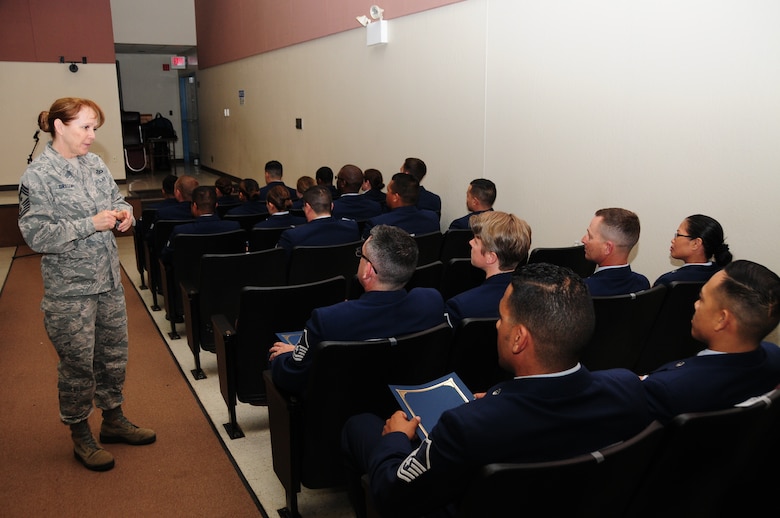 Chief Master Sgt. Cynthia Gregory, 146th Airlift Wing command chief, speaks to NCO and Senior NCO inductees during a ceremony on March 6, 2016 at Channels Islands Air National Guard Base, Calif. The ceremony was held to induct NCO and Senior NCO selectees. (Photos by Air National Guard Senior Airman Madeleine Richards)