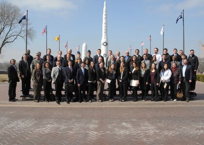 Members of U.S. Strategic Commandâ€™s (USSTRATCOM) Deterrence and Assurance Academic Alliance, as well as faculty and students from local and national universities, pose for a photo in front of USSTRATCOM Headquarters at Offutt Air Force Base, Neb., March 3, 2016. The visitors participated in a deterrence-based tabletop exercise in the commandâ€™s wargame center that was held in conjunction with the 2016 Deterrence and Assurance Workshop and Conference, an event organized by the University of Nebraska at Omahaâ€™s (UNO) Department of Political Science and the alliance. The alliance includes 23 local and national universities and was started in Oct. 2014 to stimulate new thinking and develop future generations of deterrence experts. Alliance members support USSTRATCOM and the program by promoting research topics within their departments; participating in workshops, speaking engagements and panels; and populating an electronic database with research papers and proposals on subjects related to the commandâ€™s global strategic missions.One of nine DoD unified combatant commands, USSTRATCOM has global strategic missions, assigned through the Unified Command Plan, which include strategic deterrence; space operations; cyberspace operations; joint electronic warfare; global strike; missile defense; intelligence, surveillance and reconnaissance; combating weapons of mass destruction; and analysis and targeting. (USSTRATCOM photo by Steve Cunningham)