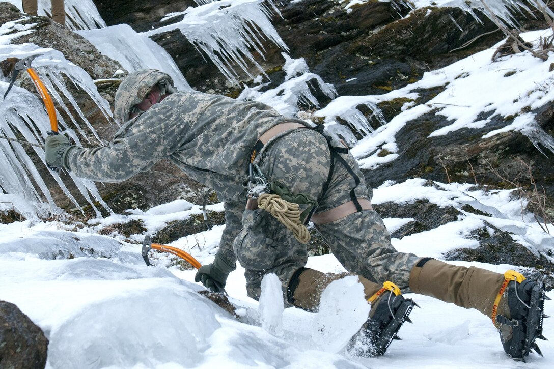 Army Spc. Isaac Merriam belays another soldier at Smuggler's Notch in Jeffersonville, Vt., March 5, 2016. Merriam is an infantry team leader assigned to the Vermont National Guard’s Company A, 3rd Battalion, 172nd Infantry Regiment, 86th Infantry Brigade Combat Team, Mountain. Soldiers performed basic and advanced mountain warfare skills including ice climbing, mountain movement techniques, and nighttime navigation as part of their winter mountaineering training. Vermont Army National Guard photo by Spc. Avery Cunningham