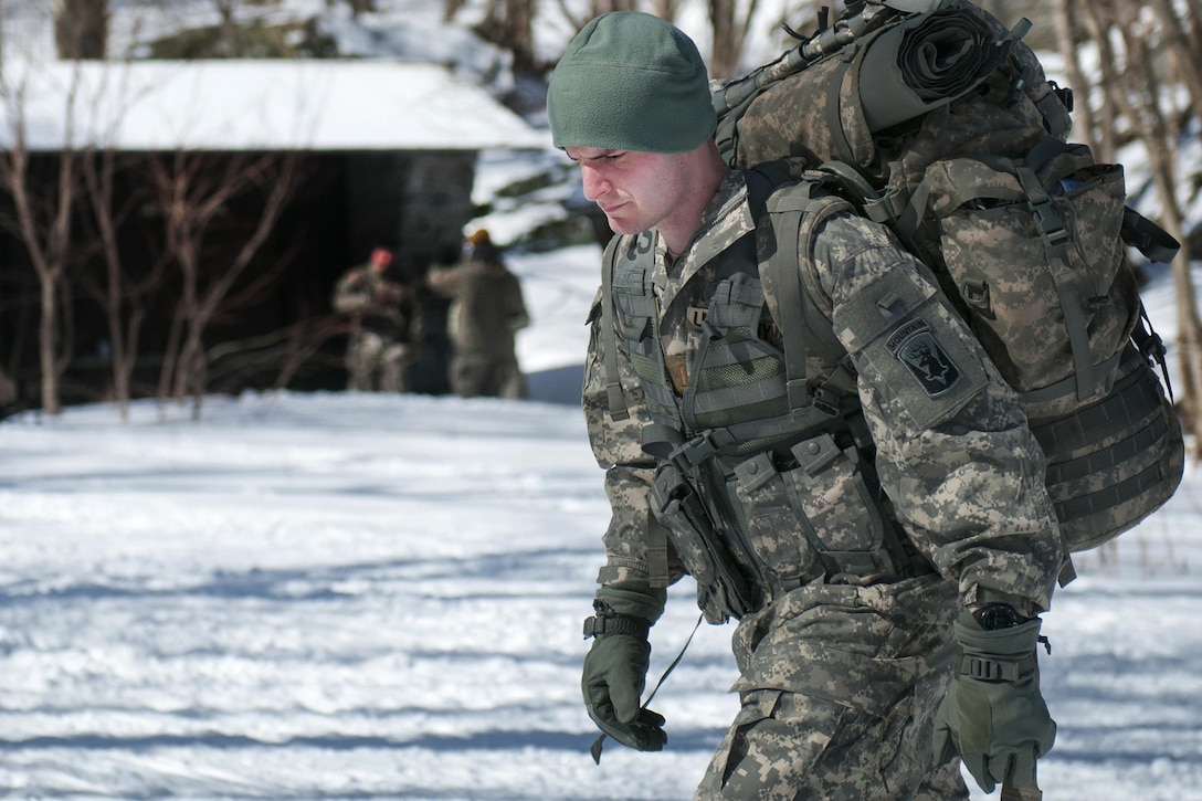 A soldier hikes up Smuggler's Notch in Jeffersonville, Vt., March 5, 2016. Vermont Army National Guard photo by Spc. Avery Cunningham