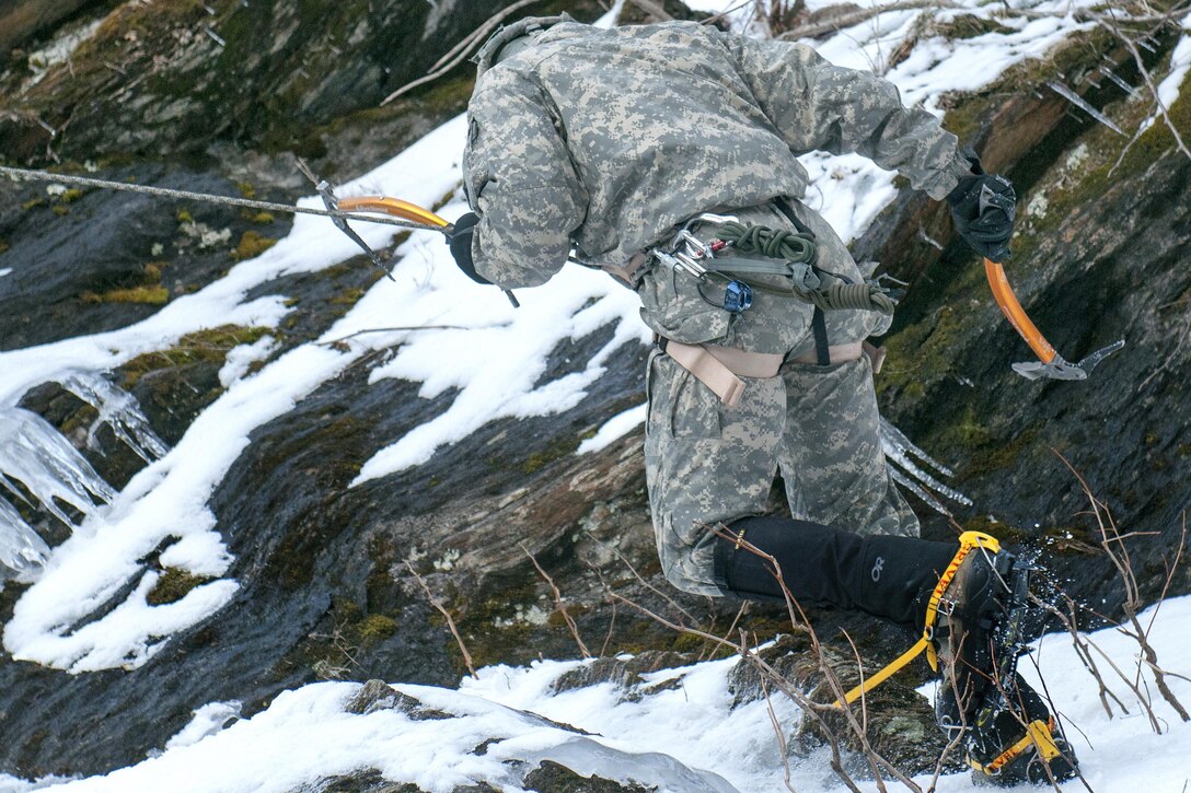 A soldier rappels down an ice wall at Smuggler's Notch in Jeffersonville, Vt., March 5, 2016. Vermont Army National Guard photo by Spc. Avery Cunningham