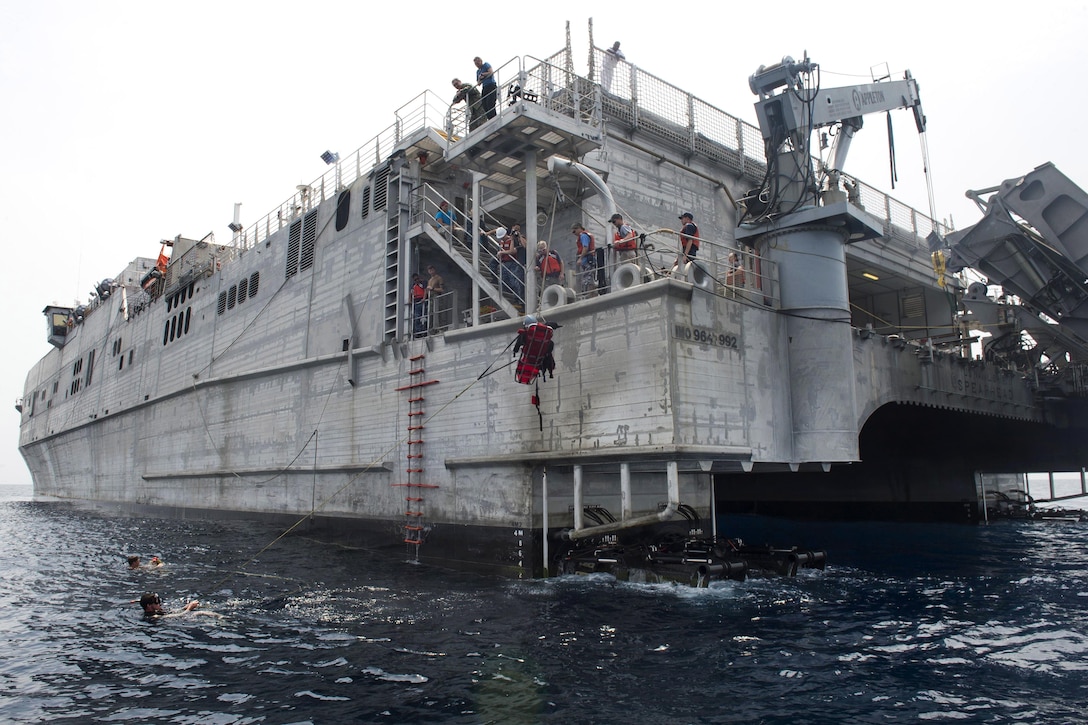 The USNS Spearhead crew and search-and-rescue swimmers participate in training in the Atlantic Ocean, March 3, 2016. Navy photo by Petty Officer 1st Class Amanda Dunford