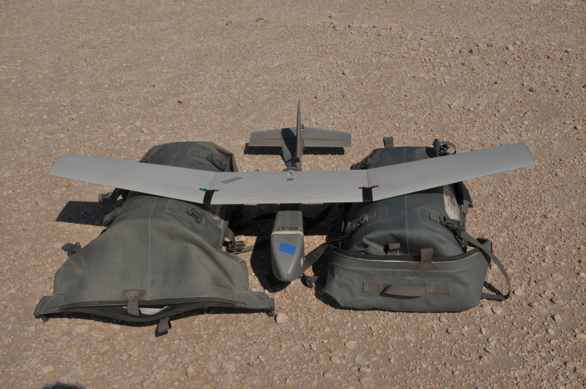 The Raven B Digital Data Link drone, a small unmanned aircraft or drone, it takes images and video of the base perimeter to ensure the safety of personnel at Al Udeid Air Base, Qatar. As the Raven B travels the preprogrammed route, it transmits still images and full motion video to a ground control system. The drone flies between 60-90 minutes depending on the weather. (U.S. Air Force photo by Tech. Sgt. Terrica Y. Jones/Released) 