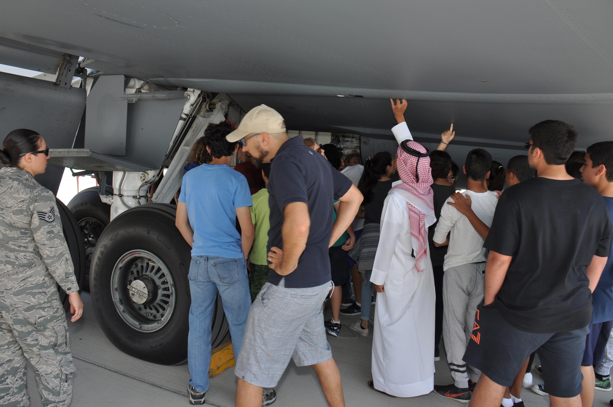 Approximately 200 American School of Doha students tour a KC-135 Stratotanker during a visit to Al Udeid Air Base, Qatar March 3. The students also received briefings on the aircraft’s capabilities. During the visit, students also watched a military working dog demonstration and met with U.S. Airmen from a variety of specialties. (U.S. Air Force photo by Tech. Sgt. James Hodgman/Released)