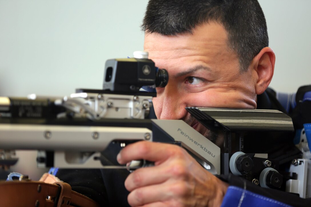Army veteran Jorge Avalos gets his sight picture before firing, while training for the shooting event at the Army trials on Fort Bliss, Texas, March 1, 2016. Army photo by Sgt. Jason Edwards