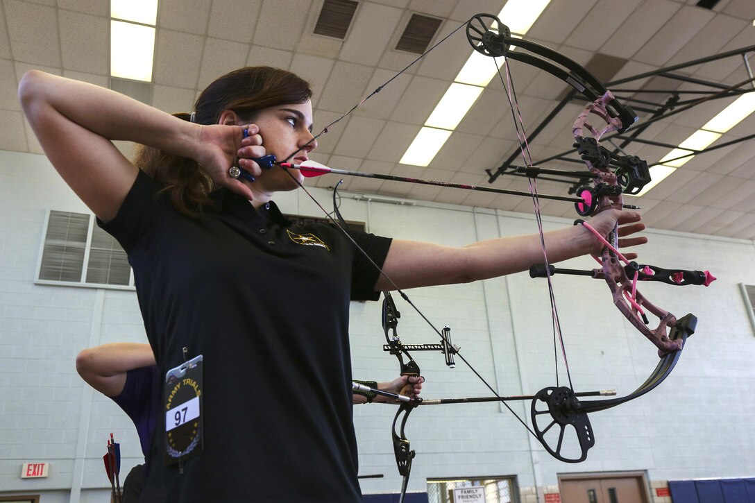 Army Spc. Dustin Shepard draws her bow during archery training during the Army Trials on Fort Bliss, Texas, March 1, 2016. Army photo by Pfc. Ian Ryan