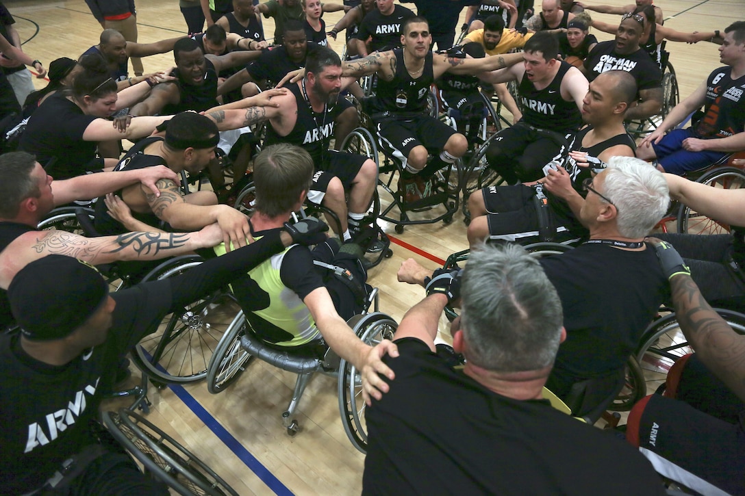 Army basketball athletes huddle up at the conclusion of training for the day during the Army Trials on Fort Bliss, Texas, March 1, 2016. Army photo by Pvt. Antonio Lewis
