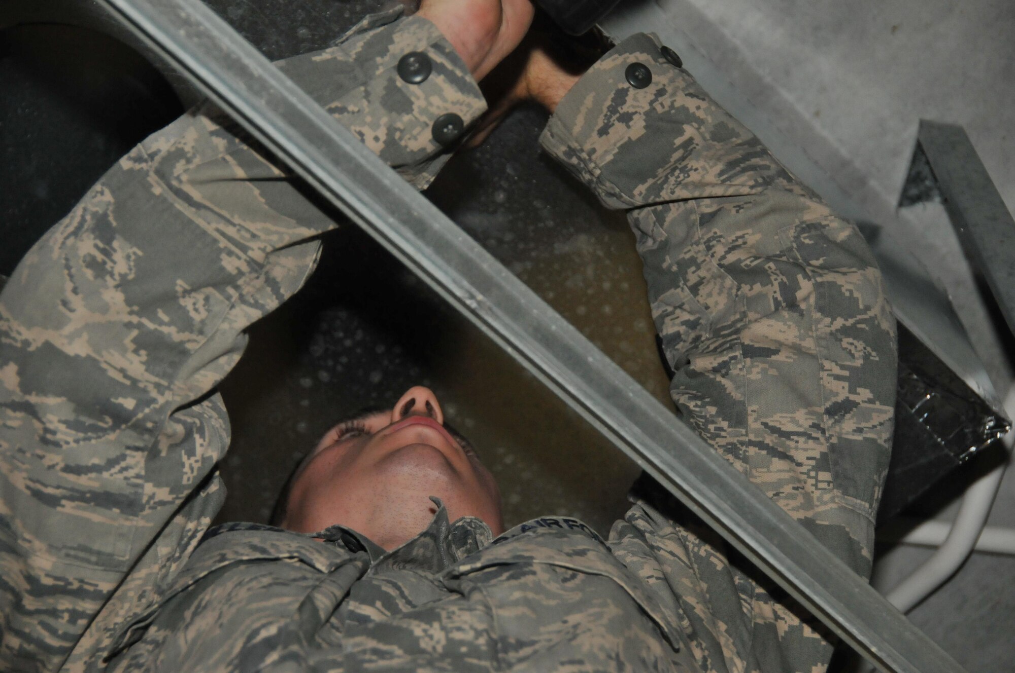 Airman 1st Class David Miller, 379th Expeditionary Civil Engineer Squadron structural specialist, measures duct work for a new heating ventilation and air conditioning system Mar. 1 at Al Udeid Air Base, Qatar. HVAC system replacement is one of the renovations the Cadillac Renovation Team does to ensure the latrine units or Cadillacs are ready for personnel use. (U.S. Air Force photo by Tech. Sgt. Terrica Y. Jones)