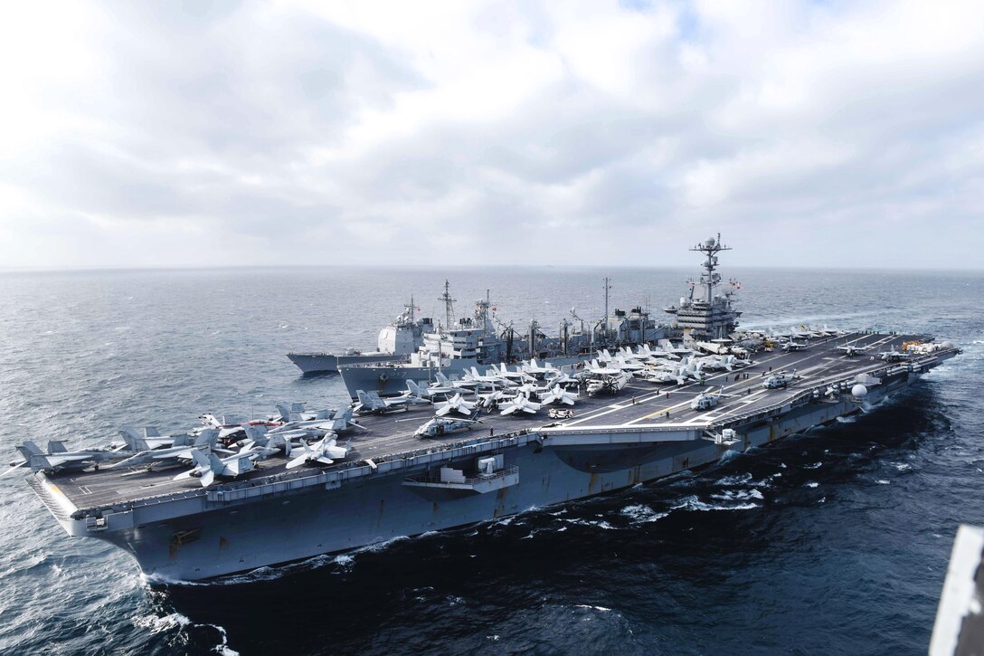 The aircraft carrier USS John C. Stennis participates in a replenishment at sea with the fast combat support ship USNS Rainier and the guided-missile cruiser USS Mobile Bay in the South China Sea, March 4, 2016. Navy photo by Petty Officer 2nd Class Andrew P. Holmes