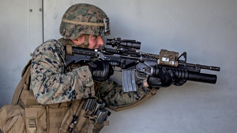 Lance Cpl. Parker Chase gets into position as the point man in his fire team during combat marksmanship training at Marine Corps Base Camp Pendleton, California, March 2, 2016. The training was part of the Urban Leaders Course taught by 1st Marine Division Schools. 