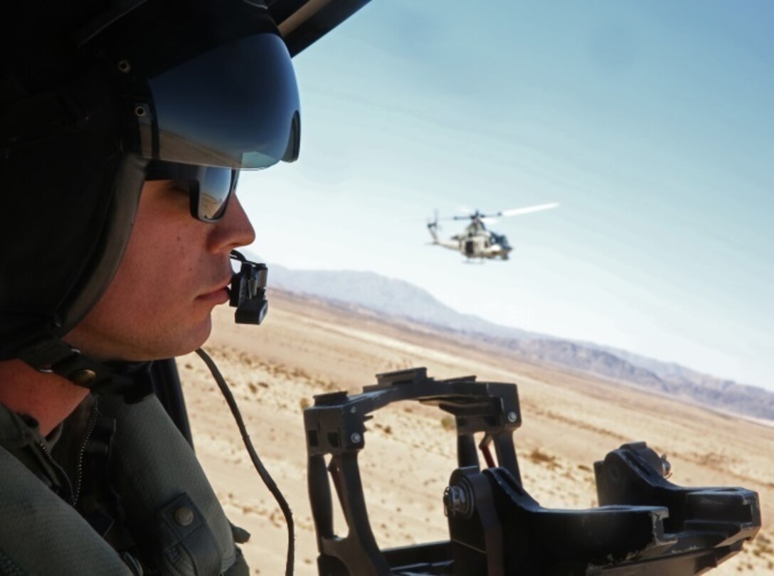 Lance Cpl. Gerald J. Demontmollin III scans the area for targets inside of a UH-1Y Venom Feb. 24, 2016, at Marine Corps Base Camp Pendleton, Calif. Demontmollin and his squadron performed simulated assault and close air support training to maintain unit readiness. Demontmollin, from Grass Valley, is a crew chief with Marine Light Attack Helicopter Squadron 169, Marine Aircraft Group 39, 3rd Marine Air Wing. 