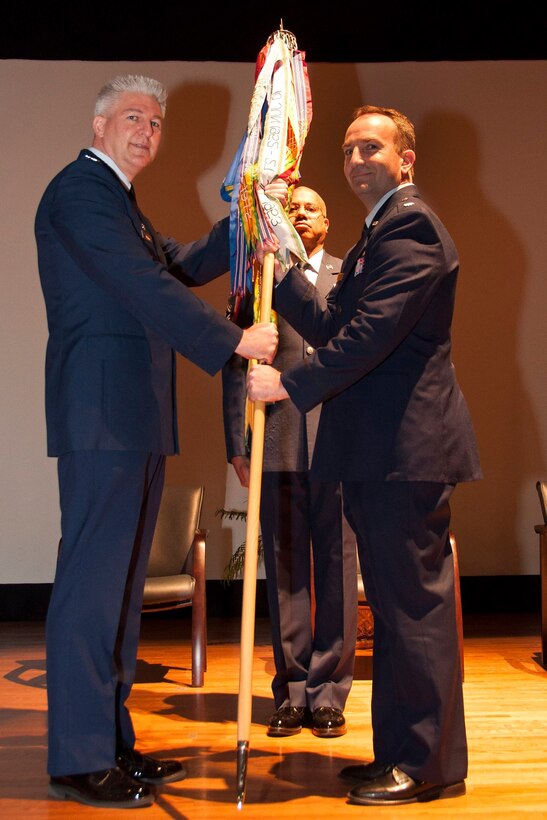 Lt. Col. Keith Eubanks, former 315th Maintenance Operations Flight commander (right),  accepts the squadron guidon from Col. Richard Gay, 315th MXG commander (left). Eubanks assumed command of the 315th MXS  during a  change of command ceremony at the base theater at JB Charleston, S.C.  (U.S. Air Force photo by Staff Sgt. Bobby Pilch)