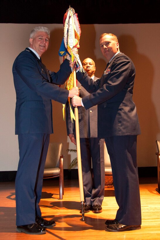 Lt. Col. Walter R. Fletcher (right), former commander of the 315th Maintenance Squadron passes the squadron guidon to Col. Richard Gay, 315th MXG commander (left). Lt. Col. Keith Eubanks, former 315th Maintenance Operations Flight commander assumed command of the 315th MXS  during a  change of command ceremony at the base theater at JB Charleston, S.C.  (U.S. Air Force photo by Staff Sgt. Bobby Pilch)