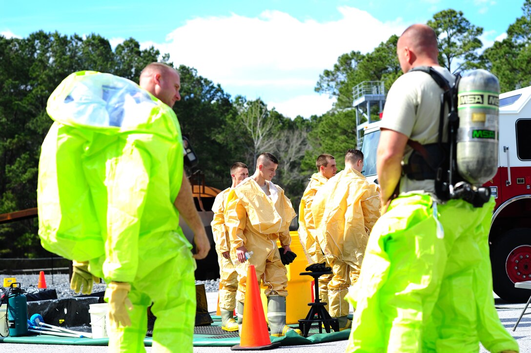 Airmen from the 315th Civil Engineering Flight conduct an exercise at their training facility at Joint Base Charleston, S.C., March 5, 2016. Members faced a scenario that required the cooperation between their firefighters, emergency management and explosive ordinance device units in order to develop a safe solution, while properly using their safety equipment. (U.S. Air Force photo by Senior Airman Jonathan Lane)
