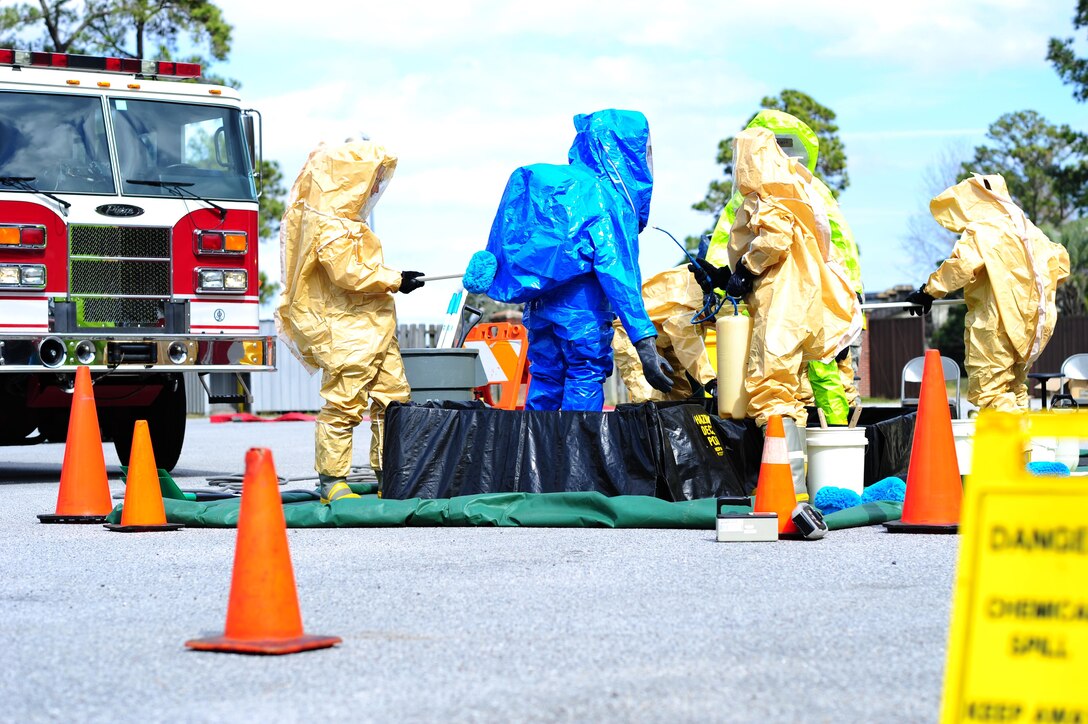 Airmen from the 315th Civil Engineering Flight conduct an exercise at their training facility at Joint Base Charleston, S.C., March 5, 2016. Members faced a scenario that required the cooperation between their firefighters, emergency management and explosive ordinance device units in order to develop a safe solution, while properly using their safety equipment. (U.S. Air Force photo by Senior Airman Jonathan Lane)