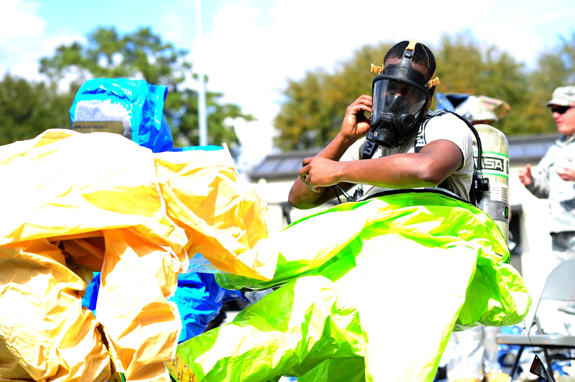 Airmen from the 315th Civil Engineering Flight conduct an exercise at their training facility at Joint Base Charleston, S.C., March 5, 2016. Members faced a scenario that required the cooperation between their firefighters, emergency management and explosive ordinance device units in order to develop a safe solution, while properly using their safety equipment. (U.S. Air Force photo by Senior Airman Jonathan Lane)