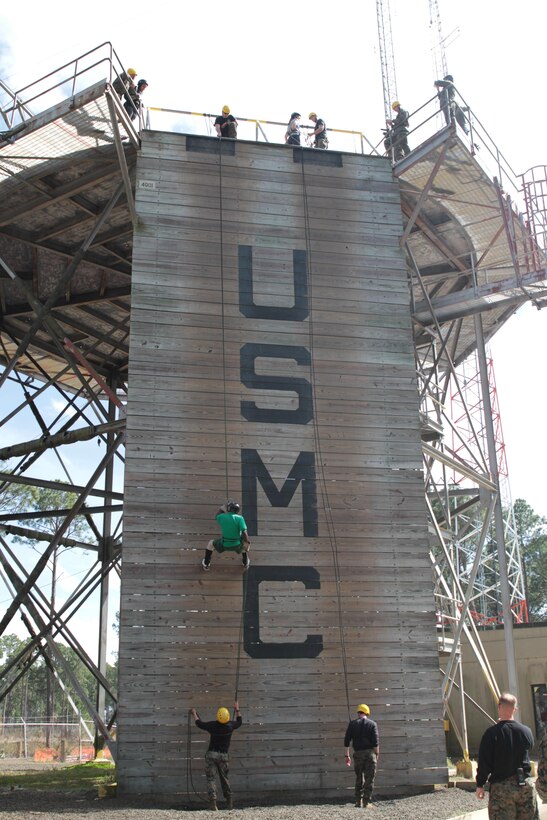 Educators scale down a fifty-foot rappel tower March 3, 2016, aboard Marine Corps Recruit Depot Parris Island, S.C. The rappel tower is one of the many feets Marine recruits must face in order to earn the title Marine. The educators are a part of a three-day workshop that informs them about Marine Corps bootcamp and lifestyle. (Official Marine Corps photo by Cpl. Diamond N. Peden/Released)