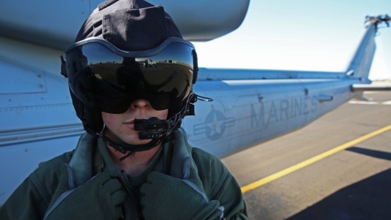 Lance Cpl. Gerald J. Demontmollin III stands in front of a UH-1Y Venom aircraft Feb. 24, 2016, at Marine Corps Base Camp Pendleton, Calif. Demontmollin and his squadron performed simulated assault and close air support training to maintain unit readiness. Demontmollin, from Grass Valley, is a crew chief with Marine Light Attack Helicopter Squadron 169, Marine Aircraft Group 39, 3rd Marine Air Wing.