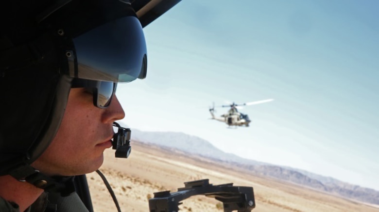 Lance Cpl. Gerald J. Demontmollin III scans the area for targets inside of a UH-1Y Venom Feb. 24, 2016, at Marine Corps Base Camp Pendleton, Calif. Demontmollin and his squadron performed simulated assault and close air support training to maintain unit readiness. Demontmollin, from Grass Valley, is a crew chief with Marine Light Attack Helicopter Squadron 169, Marine Aircraft Group 39, 3rd Marine Air Wing. 