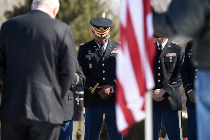 Army Reserve soldiers bow their heads during an invocation at the memorial service for Army Spc. Adriana Salem at the Memory Gardens cemetery in Arlington Heights, Ill., March 4, 2016. Sandra Salem, mother of Salem, held the memorial on the 11th anniversary of her daughter’s death. Attendees included Congresswoman Tammy Duckworth, former Illinois Gov. Patrick Quinn, Illinois Patriot Guard, and Army Reserve soldiers from the 85th Support Command and 85th Army Band. Salem, assigned to the 3rd Infantry Division, was killed in Remagen, Iraq, on March 4, 2005. (U.S. Army photo by Mr. Anthony L. Taylor/Released)