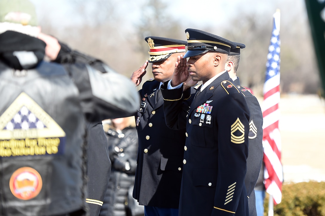 Army Reserve soldiers render a salute during the memorial service for Army Spc. Adriana Salem at the Memory Gardens cemetery in Arlington Heights, Ill., March 4, 2016. Sandra Salem, mother of Salem, held the memorial on the 11th anniversary of her daughter’s death. Attendees included Congresswoman Tammy Duckworth, former Illinois Gov. Patrick Quinn, Illinois Patriot Guard, and Army Reserve soldiers from the 85th Support Command and 85th Army Band. Salem, assigned to the 3rd Infantry Division, was killed in Remagen, Iraq, on March 4, 2005. (U.S. Army photo by Mr. Anthony L. Taylor/Released)