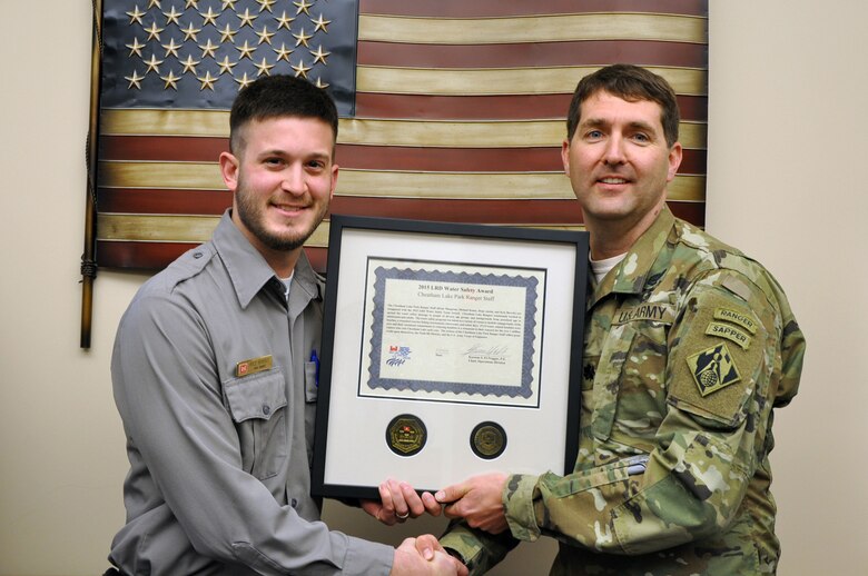 Park Ranger Kyle Beverly receives a water safety award from the U.S. Army Corps of Engineers Great Lakes and Ohio River Division during a ceremony March 1, 2016 for Cheatham Lake's outreach efforts to people of diverse age groups and backgrounds.  Lt. Col. Stephen Murphy, Nashville District commander, made the presentation on behalf of Operations Division Chief, Kareem S. El-Naggar.  