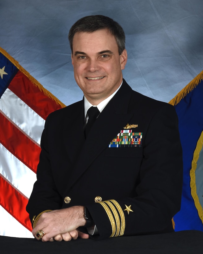 Cmdr. Beck grew up in Midland, Texas and graduated from the U.S. Naval Academy in 1992 with a degree in computer science. His first tour of duty was on USS GUNSTON HALL (LSD 44) from January 1993 to March 1996, where he served as Electrical Officer, Combat Information Center Officer, and Assistant Operations Officer. He qualified OOD, SWO, CDO, TAO, and EOOW. CDR Beck’s second division officer tour was aboard USS LABOON (DDG 58) from March 1996 to October 1997. He served as the A, E, and R Division Officer and as Assistant Engineer.