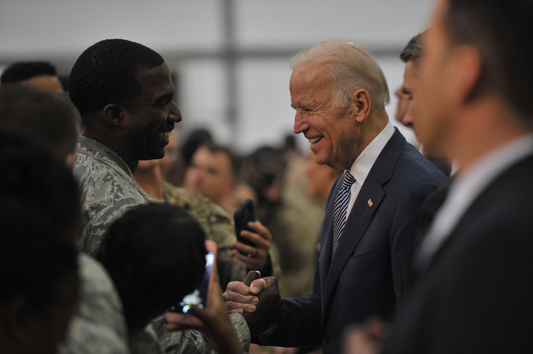 Vice President Joe Biden shakes hands with Staff Sgt. Demetric, 380th Expeditionary Force Support Squadron base fitness program manager, at an undisclosed location in Southwest Asia, March 7, 2016. Biden and his wife, second lady Dr. Jill Biden, shook hands and posed for photos with U.S. and coalition members before departing the base for the next part of their tour of the Mideast.  (U.S. Air Force photo by Staff Sgt. Kentavist P. Brackin/released)