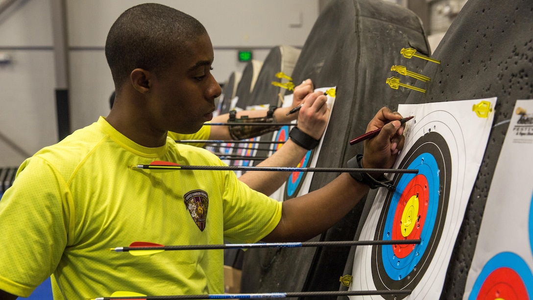 A U.S. Marine with Wounded Warrior Battalion– East assesses his shot grouping at archery practice during the 2016 Marine Corps Trials at Marine Corps Base Camp Pendleton, Calif., March 6, 2016. The Trials, an eight-event adaptive sports competition, is hosted by the Wounded Warrior Regiment, the Marine Corps command that facilitates the integration of non-medical and medical care to wounded, ill, injured Marines and their families. The Trials began March 2, 2016, and end March 9, 2016.