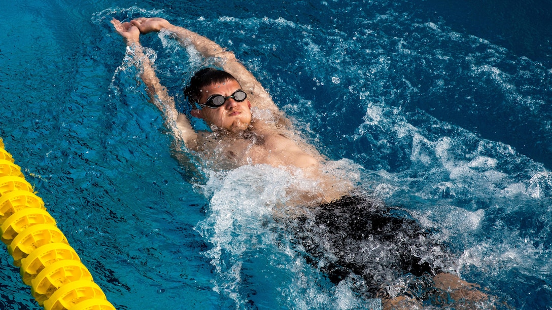 A U.S. Marine with the Wounded Warrior Regiment practices the backstroke during an orientation to swimming as part of the 2016 Marine Corps Trials at Marine Corps Base Camp Pendleton, Calif., March 4, 2016. The Trials, an eight-event adaptive sports competition, is hosted by the Wounded Warrior Regiment, the Marine Corps command that facilitates, the integration of non-medical and medical care to wounded, ill, and injured Marines and their families. The Trials began March 2, 2016, and end March 9, 2016. 