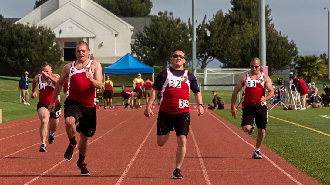 U.S. Marines with the Wounded Warrior Regiment participate in the 100-meter dash during the track competition during the 2016 Marine Corps Trials at Marine Corps Base Camp Pendleton, Calif., March 4, 2016. The Trials, an eight-event adaptive sports competition, is hosted by the Wounded Warrior Regiment, the Marine Corps command that facilitates, the integration of non-medical and medical care to wounded, ill, and injured Marines and their families. The Trials began March 2, 2016, and end March 9, 2016.