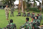 U.S. Army Sgt. 1st Class Christian Staszkow, a member of the Hawaii Army National Guard, conducts an after action review with Soldiers from the Indonesia Army following an infantry patrol practical exercise during the Noncommissioned Officer Subject Matter Expert Exchange for the Hawaii Army National Guard State Partnership Program in Bandung, Indonesia, at the PUSDIKIF Infantry Education Center Feb. 26, 2016. The NCO exchange is designed for military personnel from Hawaii and the Indonesian NCOs to learn each other’s military tactics, procedures and culture all while building a lasting friendship.