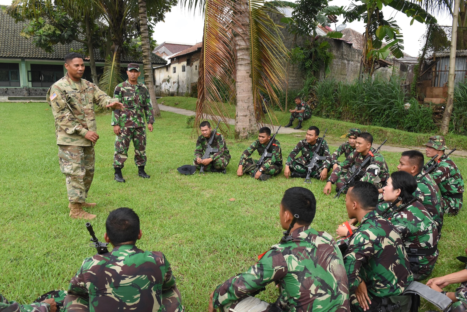 U.S. Army Sgt. 1st Class Christian Staszkow, a member of the Hawaii Army National Guard, conducts an after action review with Soldiers from the Indonesia Army following an infantry patrol practical exercise during the Noncommissioned Officer Subject Matter Expert Exchange for the Hawaii Army National Guard State Partnership Program in Bandung, Indonesia, at the PUSDIKIF Infantry Education Center Feb. 26, 2016. The NCO exchange is designed for military personnel from Hawaii and the Indonesian NCOs to learn each other’s military tactics, procedures and culture all while building a lasting friendship.