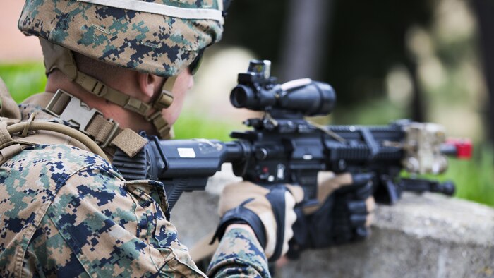 U.S. Marine Corps Lance Cpl. Noah S. Scalish, automatic rifleman, 2nd platoon, Bravo Company, 1st Battalion, 8th Marine Regiment, Special-Purpose Marine Air-Ground Task Force-Crisis Response-Africa provides security during an active shooter exercise at U.S. Embassy, Lisbon, Portugal, Feb. 9, 2016. SPMAGTF-CR-AF conducts a scaled embassy reinforcement exercise at American Embassy Lisbon in coordination with the Regional Security Office and host nation security forces in order to enhance mission essential task proficiency and build relationships. 