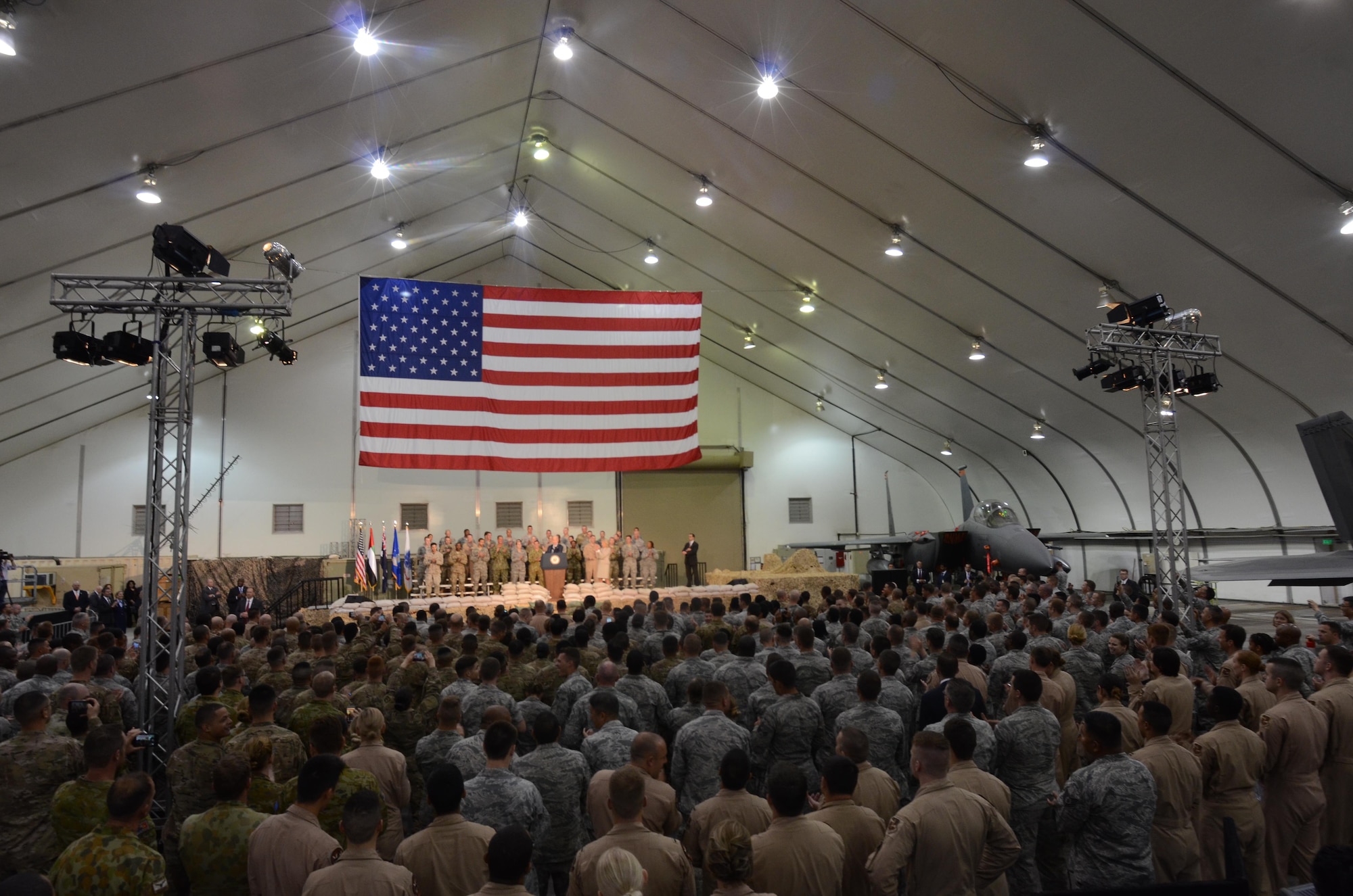 Vice President Joe Biden speaks to a crowd of more than 1,000 service members, civilians and coalition partners from five nations at an undisclosed location in Southwest Asia, Mar. 7, 2016. Biden delivered a message of thanks and appreciation for military members and their families supporting Operation Inherent Resolve. (U.S. Air Force photo by Tech. Sgt. Frank Miller/Released)