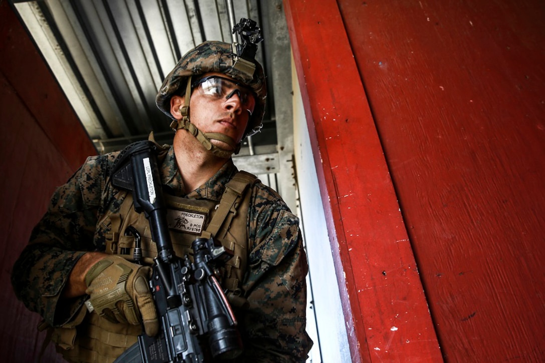 Marine Corps Lance Cpl. Roger Freckleton gets into position as the point man for his team during combat marksmanship training on Camp Pendleton, Calif., March 2, 2016. The training was part of a course to enhance small-unit leadership in an urban setting. Freckleton is a scout rifleman assigned to the 1st Marine Division's1st Light Armored Reconnaissance Battalion. Marine Corps photo by Sgt. Emmanuel Ramos