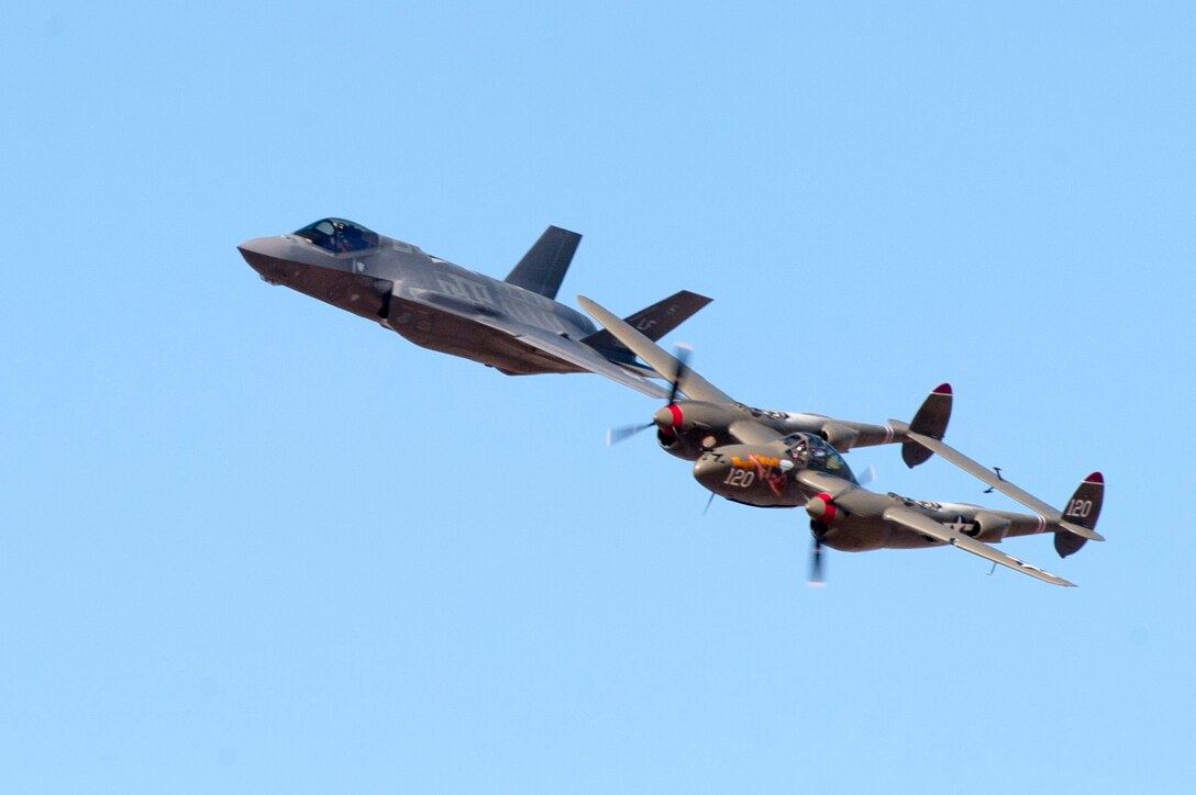 The F-35 Lightning II flies in formation with the P-38 Lightning during the Heritage Flight Conference at Davis Monthan Air Force Base in Tucson, Ariz., March 4-6, 2016.  The  F-35 heritage flight team from Luke Air Force Base, Ariz. is the first F-35 team to participate in the Heritage Flight Program. The program features modern USAF fighter aircraft flying alongside World War II, Korean and Vietnam era aircraft in a dynamic display of our nation's air power history. (U.S. Air Force photo by Staff Sgt. Staci Miller)


