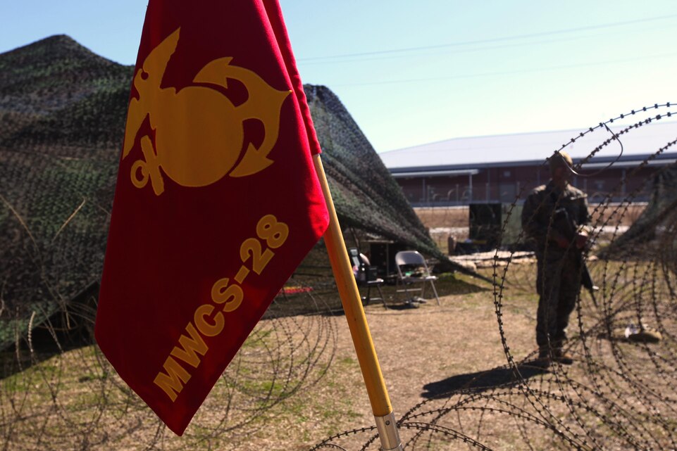A Marine with Company B, Marine Wing Communications Squadron 28 stands guard during a communications field exercise at Marine Corps Air Station Cherry Point, N.C., March 3, 2016. MWCS-28 incorporates numerous systems ranging from single-channel radios to systems with an emphasis on interoperability and beyond line-of-sight communications for a broad spectrum of information services. During the exercise, Bravo Company provided their own Tactical Air Operations Center, Tactical Air Command Center and simulated unmanned aerial vehicle squadron requests, giving the Marines a broader understanding on what roles requesting agencies play during operations within a communications squadron. (U.S. Marine Corps photo by Pfc. Nicholas P. Baird/Released)