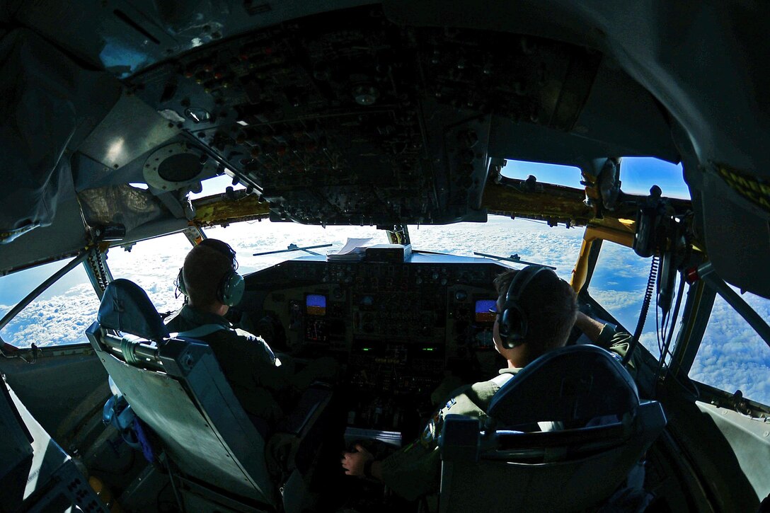 Air Force Capts. Scott Carlan, left, and Jack Ryan fly a KC-135 Stratotanker aircraft during a refueling mission in support of Operation Juniper Micron over France, Feb. 26, 2016. Air Force photo by Senior Airman Erin Trower