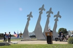 Retired Air Force Col. Robert Certain addresses the audience at the 43rd annual Freedom Flyer Reunion wreath-laying ceremony in front of the Missing Man Monument March 4, 2016, at Joint Base San Antonio-Randolph, Texas.  Certain was imprisoned for 101 days after his B-52 Stratofortress was shot down over North Vietnam Dec. 18, 1972.