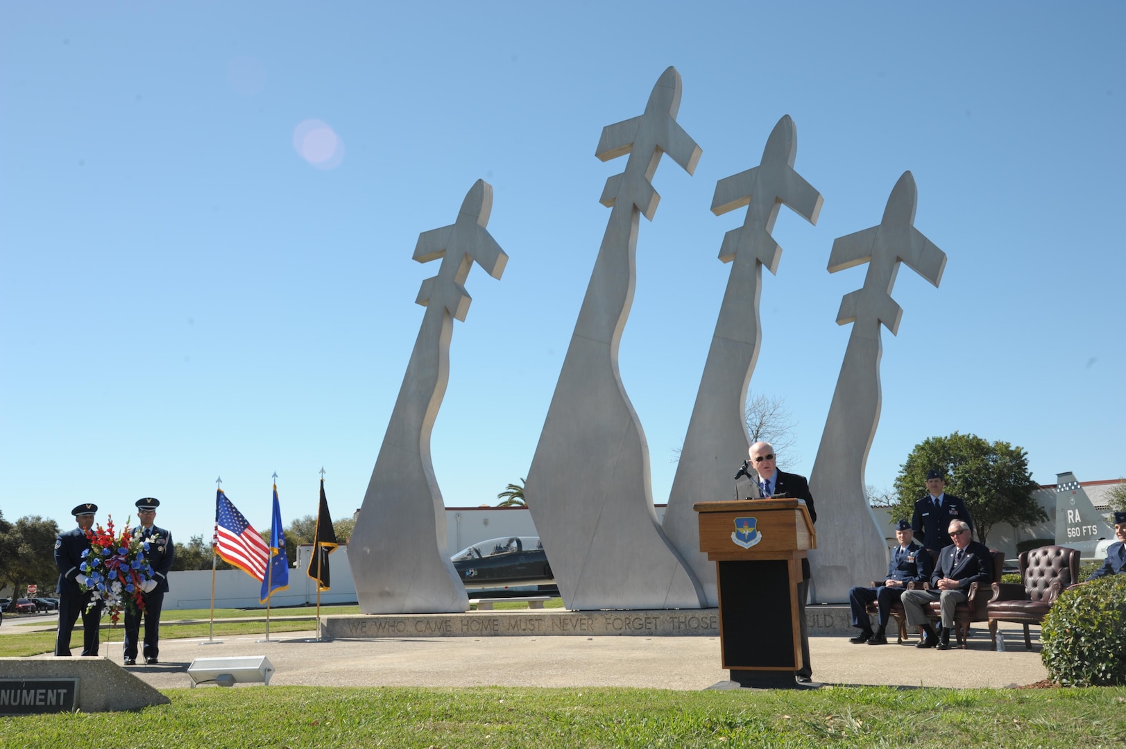 Retired Air Force Col. Robert Certain addresses the audience at the 43rd annual Freedom Flyer Reunion wreath-laying ceremony in front of the Missing Man Monument March 4, 2016, at Joint Base San Antonio-Randolph, Texas.  Certain was imprisoned for 101 days after his B-52 Stratofortress was shot down over North Vietnam Dec. 18, 1972.