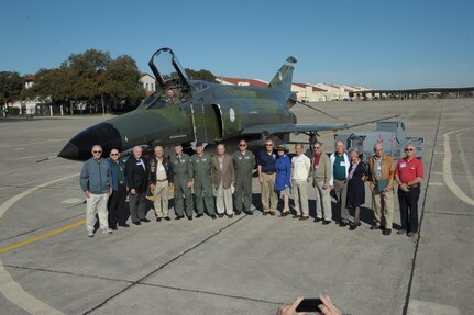 Former prisoners of war from the Vietnam conflict pose in front of an F-4 Phantom static display on the flight line March 4, 2016, at Joint Base San Antonio-Randolph, Texas.  The static display was part of the 43rd annual Freedom Flyer Reunion events.
