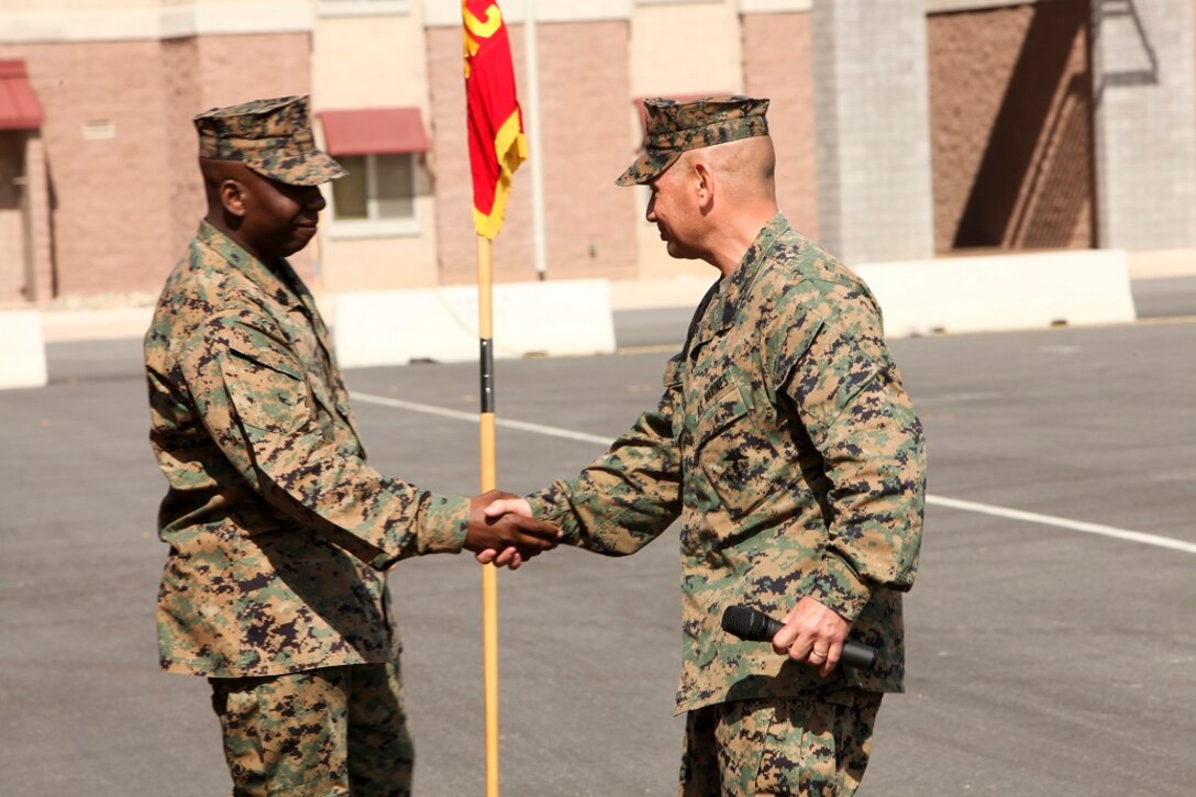 U.S. Marine Sgt. Maj. Dennis K. Campbell, left, incoming Sgt. Maj. of the 15th Marine Expeditionary Unit, shakes hands with Sgt. Maj. Douglas B. Schaefer,  right, outgoing Sgt. Maj. of the 15th MEU, during a relief and appointment ceremony aboard Camp Pendleton, Calif., Mar. 4, 2016. The 15th MEU's relief and appointment ceremony signifies the passing of responsibility from Sgt. Maj. Schaefer to Sgt. Maj. Campbell. (U.S. Marine Corps photo by Sgt. Jamean R. Berry/Released)