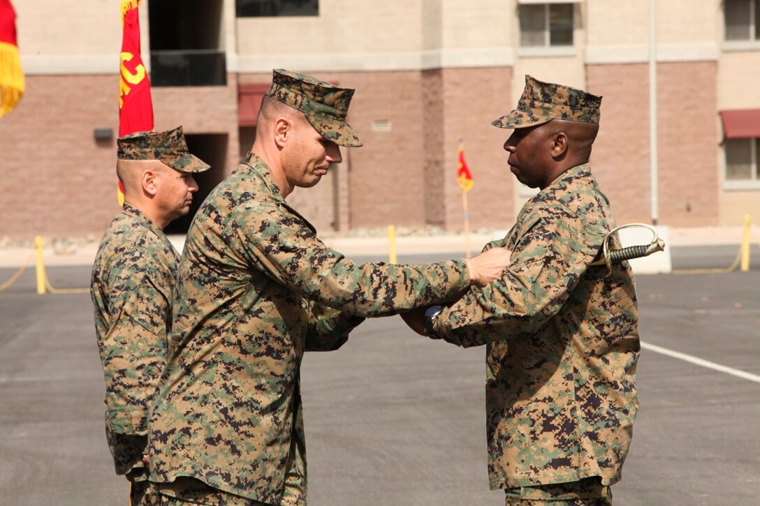 U.S. Marine Col. Vance L. Cryer, left, commanding officer of the 15th Marine Expeditionary Unit, presents the sword of office to Sgt. Maj. Dennis K. Campbell, right, incoming Sgt. Maj. of the 15th MEU, during a relief and appointment ceremony aboard Camp Pendleton, Calif., Mar. 4, 2016. The 15th MEU's relief and appointment ceremony signifies the passing of responsibility from Sgt. Maj. Douglas B. Schaefer to Sgt. Maj. Campbell. (U.S. Marine Corps photo by Sgt. Jamean R. Berry/Released)