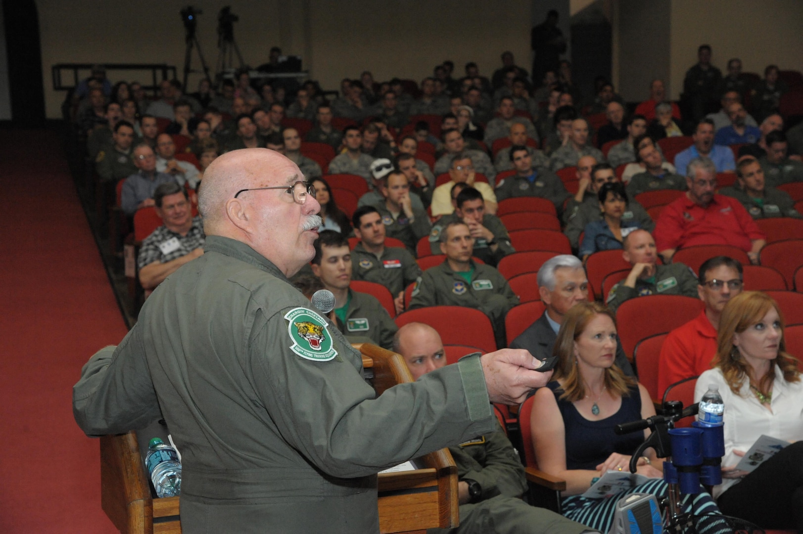 Retired Air Force Col. Joseph Milligan talks about his time in captivity in North Vietnam during the 43rd annual Freedom Flyer Symposium March 4, 2016, at Joint Base San Antonio-Randolph, Texas.  Milligan was one of five former prisoners of war who spoke at the event.