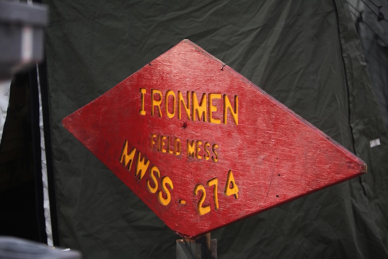 The Marine Wing Support Squadron 274 field mess identification sign stands outside the field mess at Marine Corps Air Station Cherry Point, N.C., Jan. 20, 2016. Food service specialists with MWSS-274 competed for the Maj. Gen. William Pendleton Thompson Hill Food Service Award after winning the title last year. In a field-like environment, the Marines set up the field expedient kitchen and cooked various entrées in hopes of winning the title of Best Field Mess Award. The Marines were inspected on sanitation, preparation and meal production. (U.S. Marine Corps photo by Cpl. Unique Roberts/ Released)