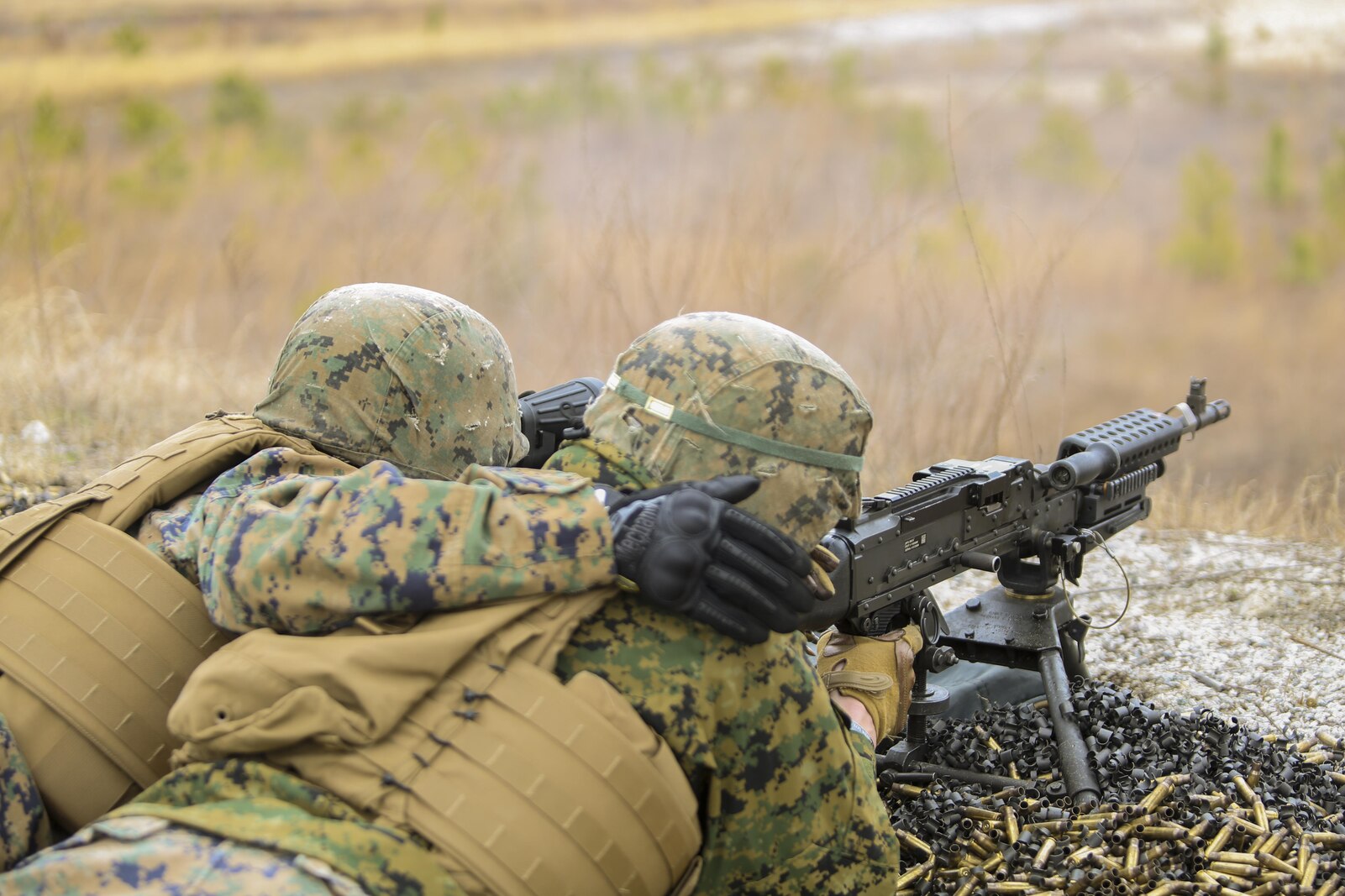 Marines with Bravo Company, 2nd Law Enforcement Battalion, participated in familiarization training at Camp Lejeune, N.C., March 4, 2016, in order to improve their marksmanship skills with the M240 machine gun and M249 squad automatic weapon. The purpose of the shoot was to hone their accuracy, communication abilities and suppressive fire capabilities in order to prepare the unit for several upcoming training exercises. (U.S. Marine Corps photo by Lance Cpl. Aaron K. Fiala/Released)