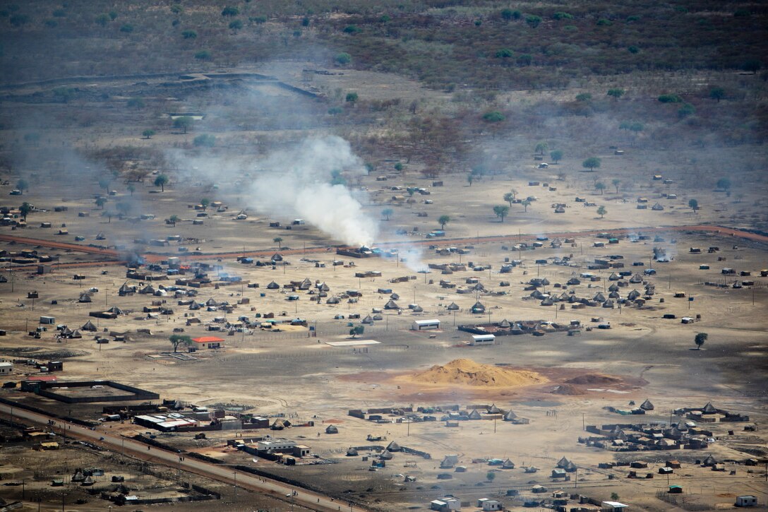 SUDAN, Abyei: A handout photo released by the United Nations Mission in Sudan (UNMIS) 23 March, shows burning homes in Abyei town. The UN said today that it strongly condemns the burning and looting currently being perpetrated by armed elements in Abyei following the seizure of the town by Northern Sudanese troops on 20 March. UNMIS PHOTO / STUART PRICE 